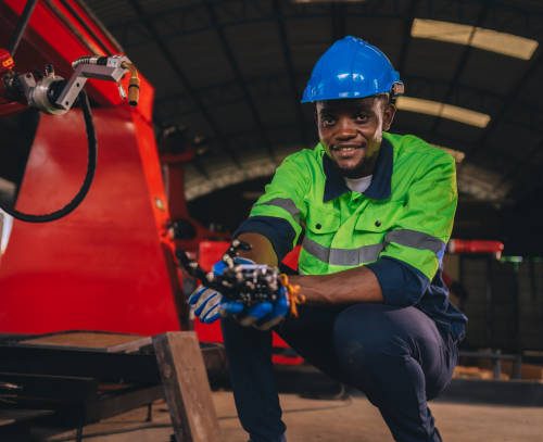 istockphoto-1817938110-612x612 Young engineer works diligently in advanced robot welding factory in modern technology world.