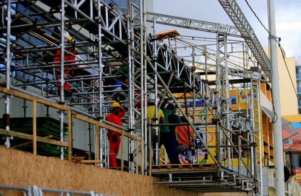salvador, bahia / brazil - february 21, 2014: workers are seen during assembly of metal structure for cabins at the carnival in the city of Salvador."n