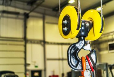 Commercial Warehouse Lift. Ceiling Mounted Heavy Duty Crane on the Production Line Inside the Warehouse